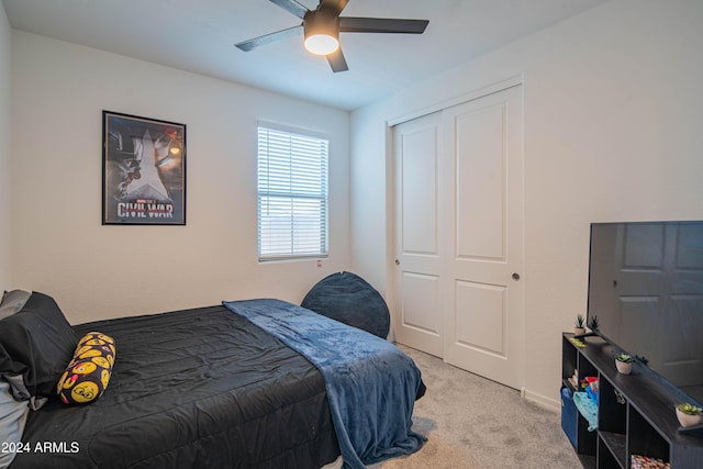 bedroom featuring light colored carpet and ceiling fan