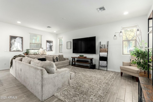 4110 S 58th Ln, Phoenix, AZ 85043 - living area with wood finish floors, visible vents, and recessed lighting