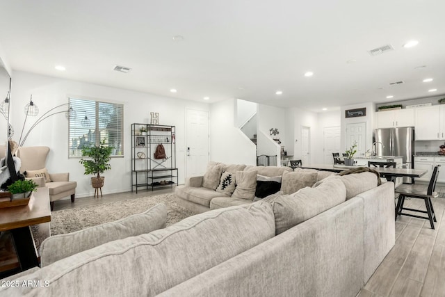 4110 S 58th Ln, Phoenix, AZ 85043 - living area featuring visible vents, recessed lighting, and light wood-type flooring