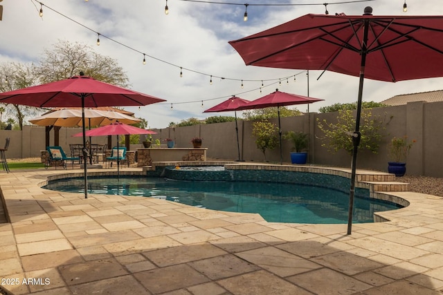 view of pool featuring an in ground hot tub and a patio area