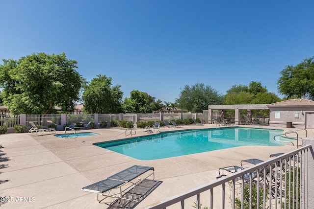 view of pool featuring a hot tub and a patio area