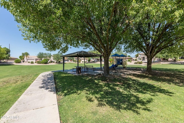 surrounding community with a gazebo, a lawn, and a playground