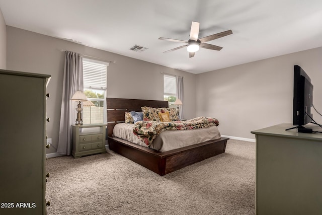 bedroom with visible vents, baseboards, a ceiling fan, and carpet flooring