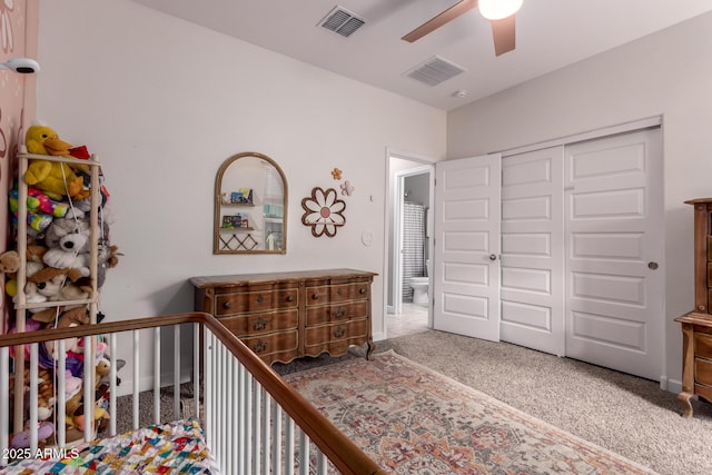 bedroom featuring carpet flooring, visible vents, a closet, and ceiling fan