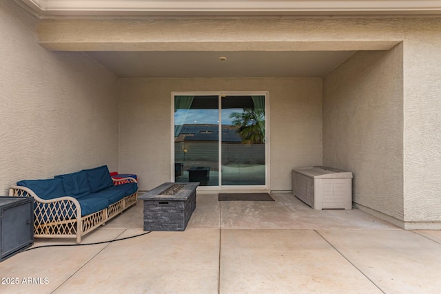 view of patio featuring an outdoor fire pit