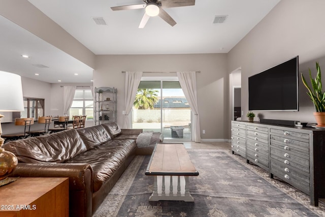 living room with visible vents, recessed lighting, baseboards, and ceiling fan