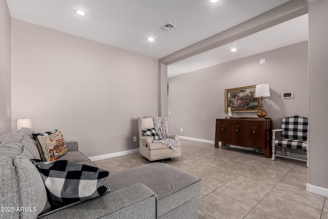 living area with recessed lighting, baseboards, and visible vents