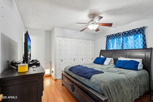 207 E Strahan Dr, Tempe, AZ 85283 - bedroom featuring light wood finished floors, a closet, a textured ceiling, and a ceiling fan