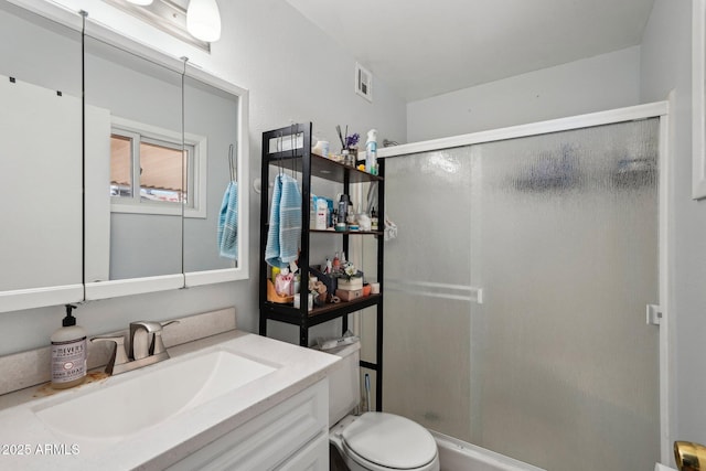 207 E Strahan Dr, Tempe, AZ 85283 - bathroom featuring a stall shower, vanity, and toilet