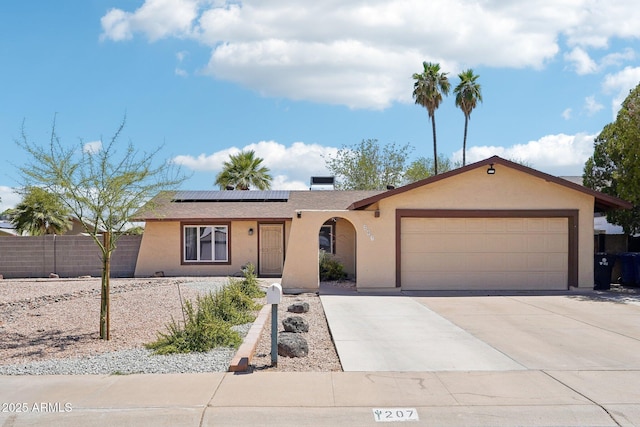 207 E Strahan Dr, Tempe, AZ 85283 - ranch-style house with a garage, stucco siding, solar panels, and driveway