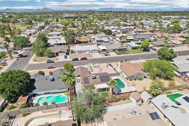 207 E Strahan Dr, Tempe, AZ 85283 - aerial overview of property's location featuring a pool, nearby suburban area, and mountains