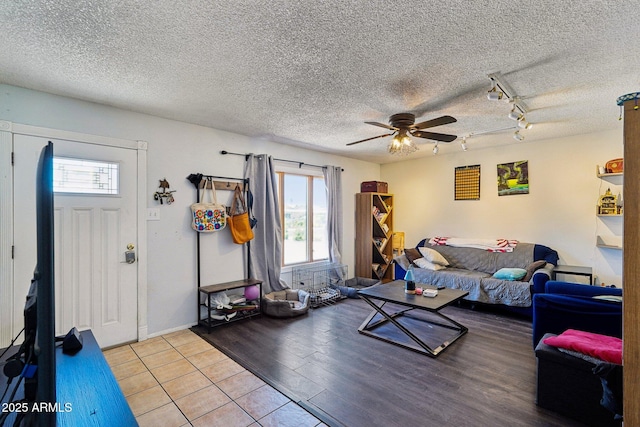 207 E Strahan Dr, Tempe, AZ 85283 - living room featuring ceiling fan, plenty of natural light, rail lighting, a textured ceiling, and light wood-style floors