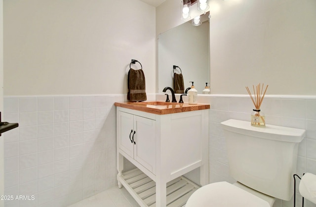 1712 E Fairfield St, Mesa, AZ 85203 - bathroom with vanity, tile walls, and a wainscoted wall
