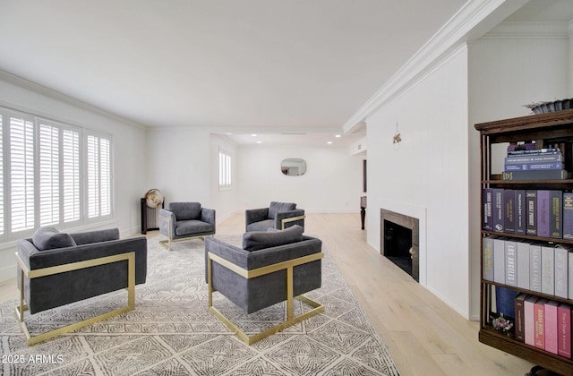 1712 E Fairfield St, Mesa, AZ 85203 - living room with wood finished floors, a fireplace, crown molding, and recessed lighting