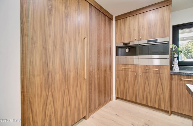 1712 E Fairfield St, Mesa, AZ 85203 - kitchen featuring stainless steel oven, light wood-type flooring, dark countertops, and modern cabinets
