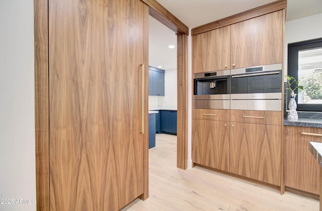 1712 E Fairfield St, Mesa, AZ 85203 - kitchen featuring light wood-style floors, modern cabinets, and dark countertops