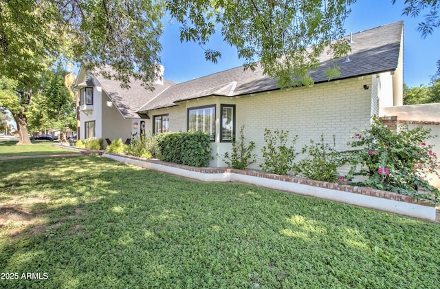1712 E Fairfield St, Mesa, AZ 85203 - view of front of house featuring brick siding, a front yard, and a shingled roof