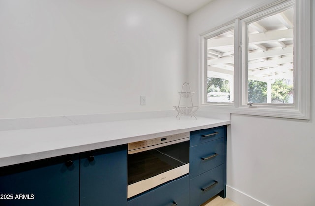 1712 E Fairfield St, Mesa, AZ 85203 - kitchen featuring blue cabinetry, oven, and light countertops