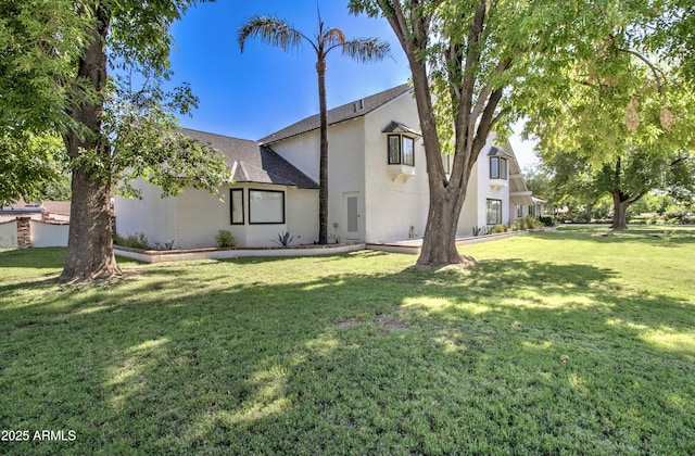 1712 E Fairfield St, Mesa, AZ 85203 - back of property with brick siding and a lawn