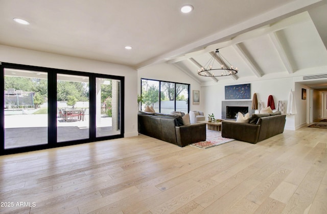 1712 E Fairfield St, Mesa, AZ 85203 - living area with light wood-style flooring, a chandelier, recessed lighting, and a fireplace