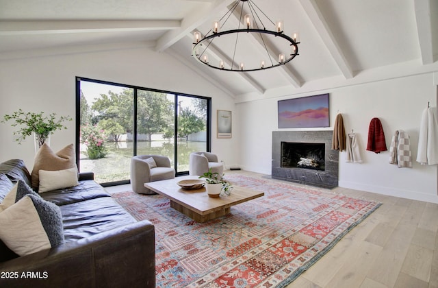 1712 E Fairfield St, Mesa, AZ 85203 - living room featuring a chandelier, beam ceiling, light wood-style floors, a fireplace, and high vaulted ceiling