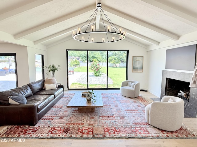 1712 E Fairfield St, Mesa, AZ 85203 - living room with a chandelier, plenty of natural light, wood finished floors, and a premium fireplace