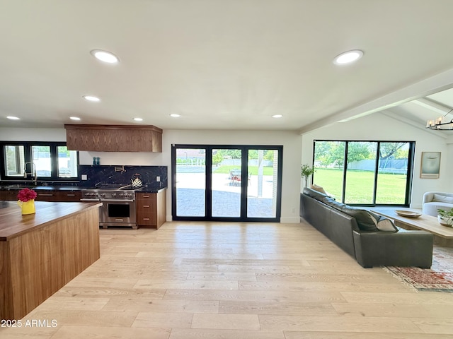 1712 E Fairfield St, Mesa, AZ 85203 - kitchen featuring high end stove, open floor plan, wooden counters, light wood-style floors, and recessed lighting
