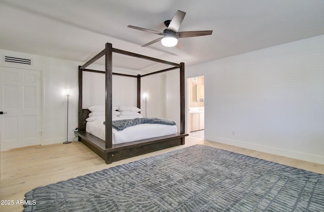 1712 E Fairfield St, Mesa, AZ 85203 - bedroom with wood finished floors, a ceiling fan, and ensuite bathroom