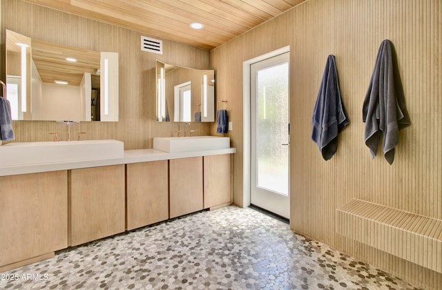 1712 E Fairfield St, Mesa, AZ 85203 - bathroom with healthy amount of natural light, double vanity, wood ceiling, recessed lighting, and wood walls