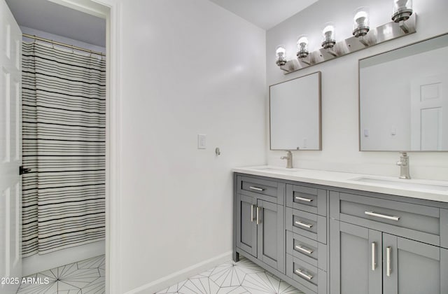 1712 E Fairfield St, Mesa, AZ 85203 - full bathroom with double vanity and baseboards