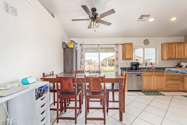 interior space with sink, stainless steel dishwasher, ceiling fan, and light tile patterned flooring