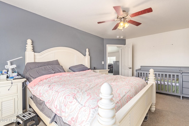 bedroom featuring light carpet and ceiling fan