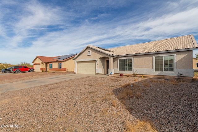 ranch-style house featuring a garage