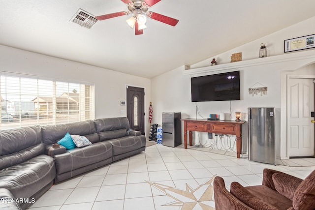 tiled living room featuring ceiling fan and lofted ceiling