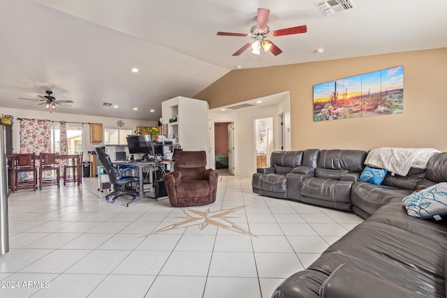 tiled living room with ceiling fan and vaulted ceiling