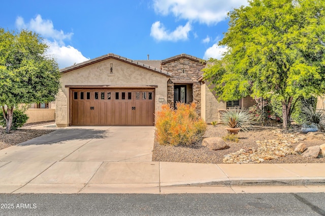 view of front of property featuring stone siding, concrete driveway, stucco siding, and an attached garage