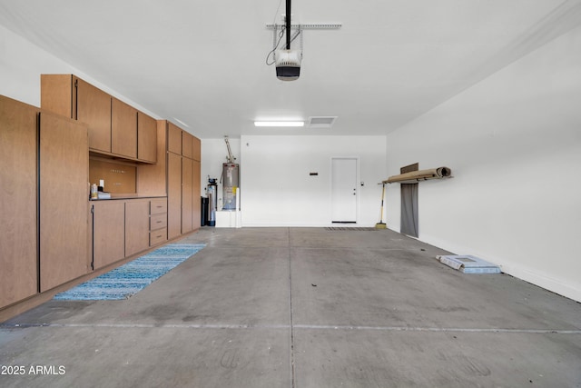 garage with water heater and a garage door opener