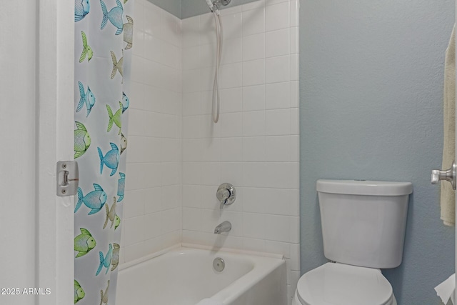 bathroom with shower / bath combo and toilet