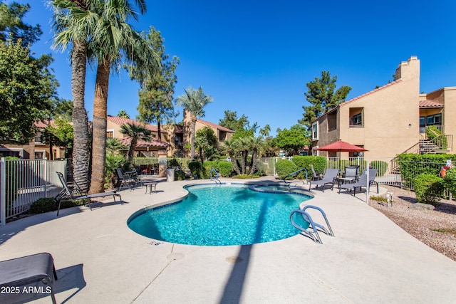 view of swimming pool with a patio