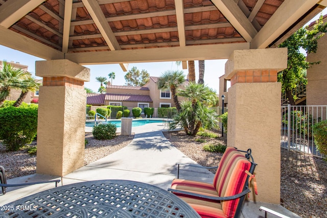 view of patio / terrace with a gazebo and a community pool