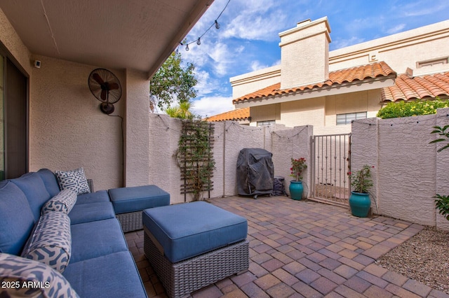 view of patio / terrace featuring a grill and an outdoor hangout area