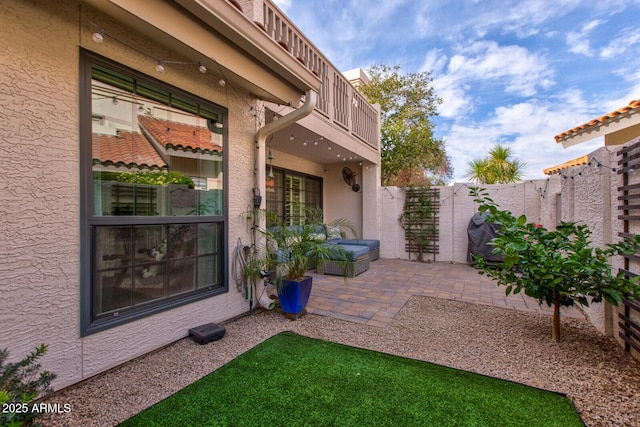 view of patio featuring a balcony