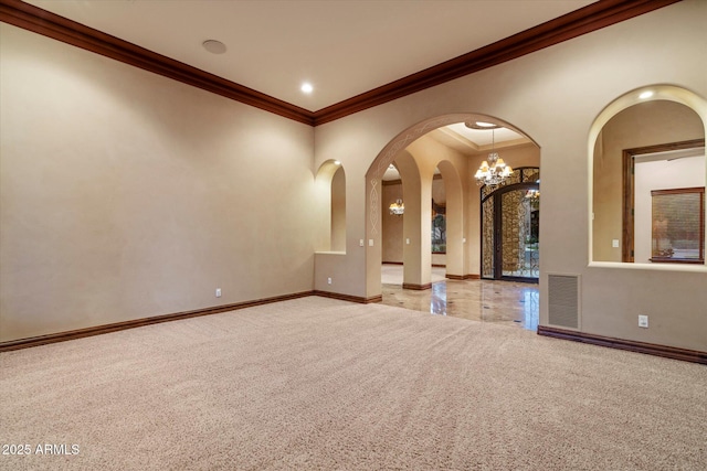 3523 E Presidio Cir, Mesa, AZ 85213 - unfurnished room featuring arched walkways, carpet floors, crown molding, baseboards, and a chandelier