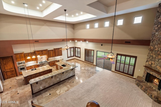 3523 E Presidio Cir, Mesa, AZ 85213 - living room with a towering ceiling, recessed lighting, a fireplace, a ceiling fan, and a raised ceiling