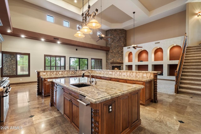 3523 E Presidio Cir, Mesa, AZ 85213 - kitchen featuring a towering ceiling, a spacious island, ceiling fan, a sink, and appliances with stainless steel finishes