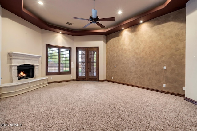 3523 E Presidio Cir, Mesa, AZ 85213 - unfurnished living room with a tray ceiling, baseboards, carpet floors, a ceiling fan, and recessed lighting