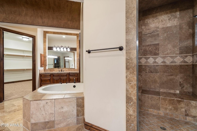 3523 E Presidio Cir, Mesa, AZ 85213 - bathroom with vanity, tiled shower, a spacious closet, and a relaxing tiled tub