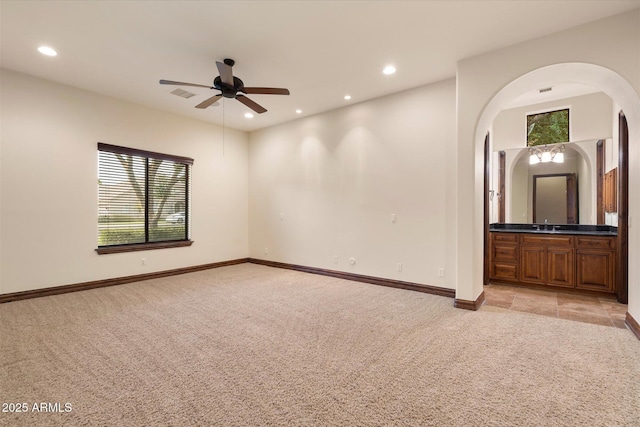 3523 E Presidio Cir, Mesa, AZ 85213 - unfurnished room featuring light colored carpet, a ceiling fan, recessed lighting, baseboards, and arched walkways