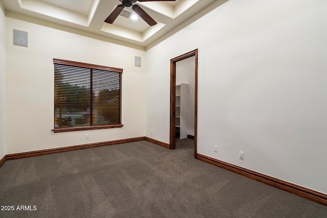 3523 E Presidio Cir, Mesa, AZ 85213 - empty room featuring a ceiling fan, dark carpet, coffered ceiling, baseboards, and beam ceiling