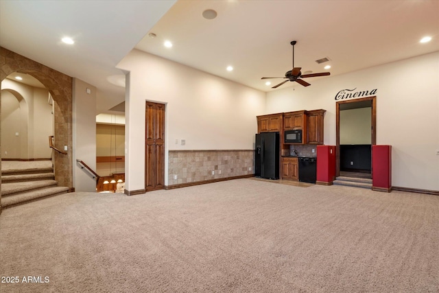 3523 E Presidio Cir, Mesa, AZ 85213 - unfurnished living room with light carpet, recessed lighting, ceiling fan, stairs, and bar